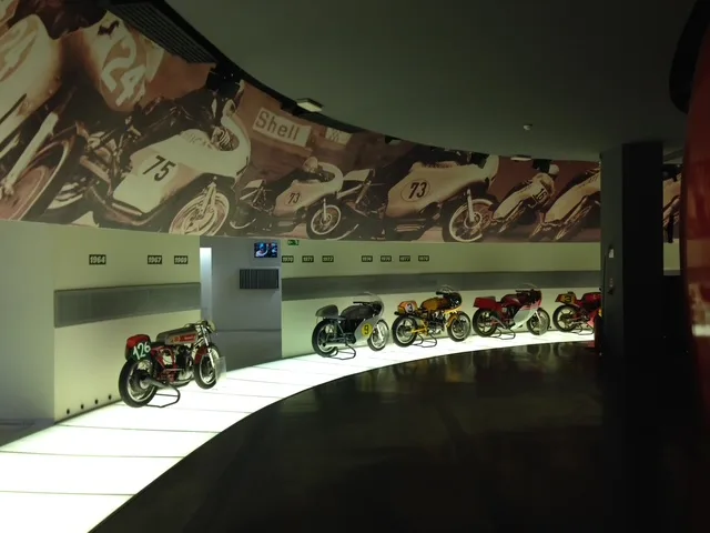 Racing motorcycles on display in a museum